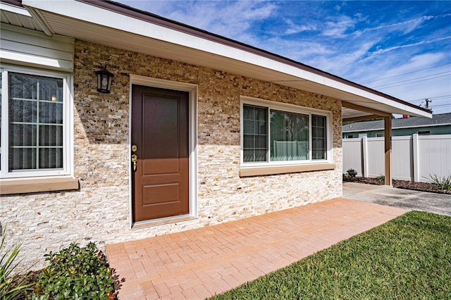 doorway to property featuring a patio area