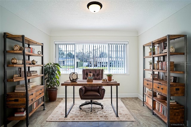 home office featuring plenty of natural light and a textured ceiling