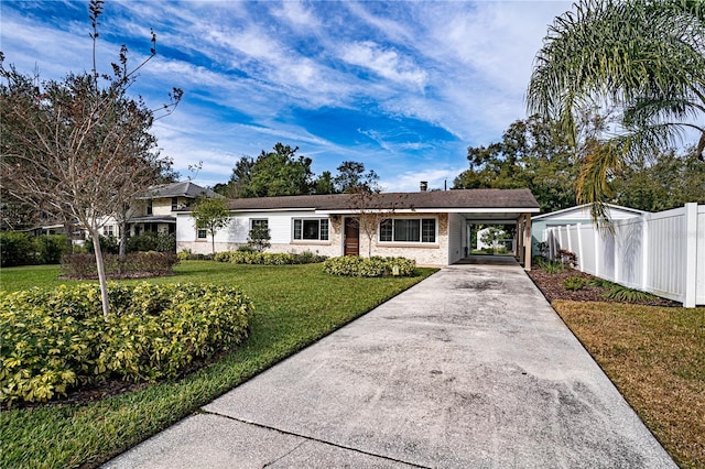 single story home with a front lawn and a carport