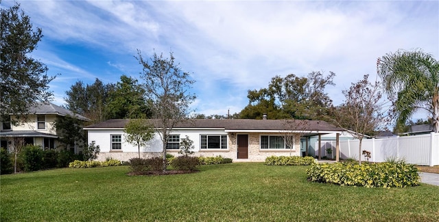 ranch-style home with a front yard