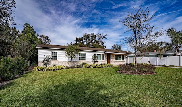 single story home with a front lawn