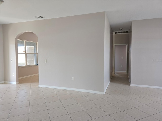 empty room featuring light tile patterned floors