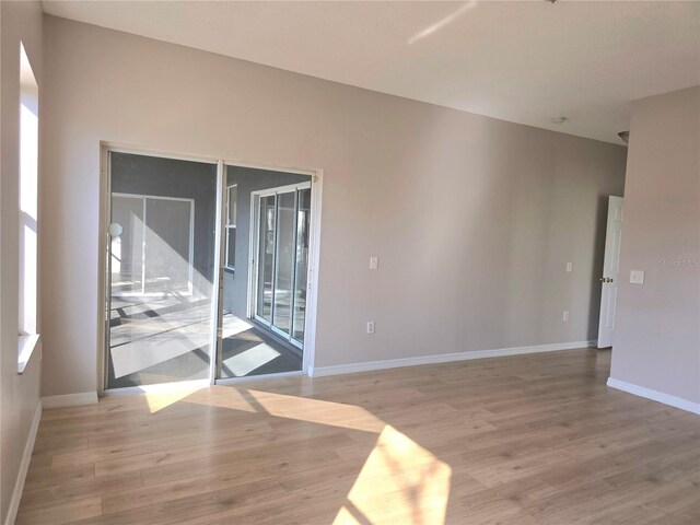 unfurnished room featuring light hardwood / wood-style floors