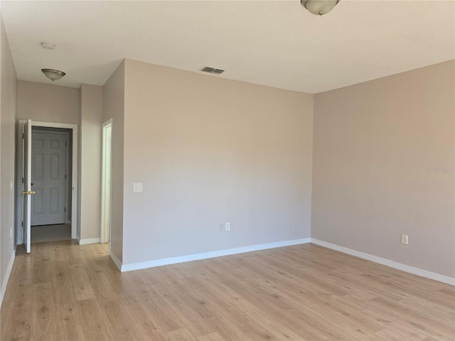 unfurnished room featuring light hardwood / wood-style flooring