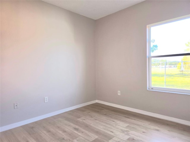 spare room with light hardwood / wood-style floors