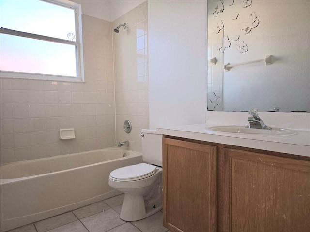 full bathroom featuring vanity, tile patterned floors, toilet, and tiled shower / bath