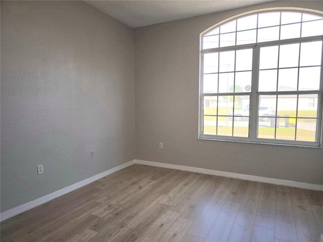 unfurnished room featuring hardwood / wood-style floors