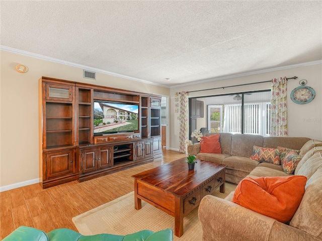 2002 Granada Ct Unit 1, Lake Wales, FL 33898 - living room featuring light wood-type flooring, crown molding, and a textured ceiling