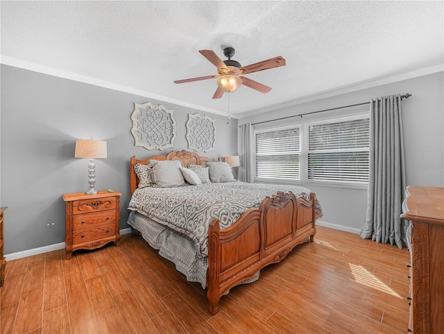 2002 Granada Ct Unit 1, Lake Wales, FL 33898 - bedroom featuring ceiling fan, wood-type flooring, a textured ceiling, and ornamental molding