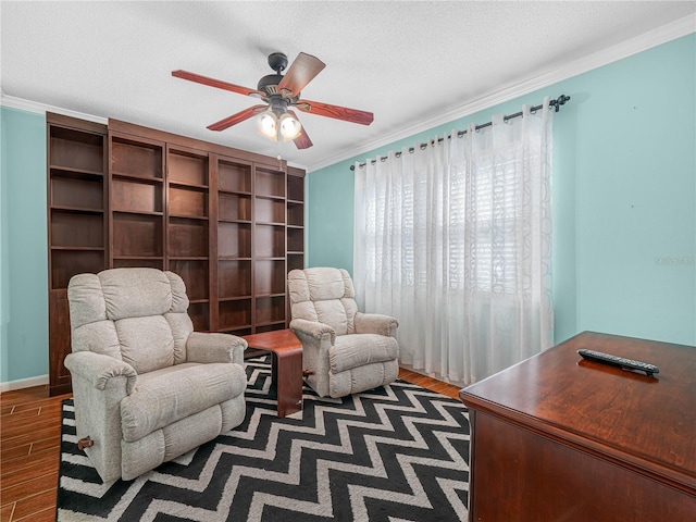 2002 Granada Ct Unit 1, Lake Wales, FL 33898 - sitting room with ceiling fan, a textured ceiling, crown molding, and dark hardwood / wood-style floors