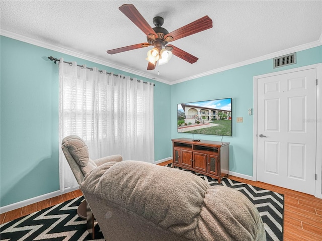 2002 Granada Ct Unit 1, Lake Wales, FL 33898 - interior space with ceiling fan, crown molding, wood-type flooring, and a textured ceiling