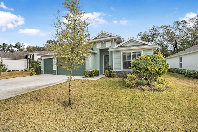 view of front of property featuring a garage and a front lawn