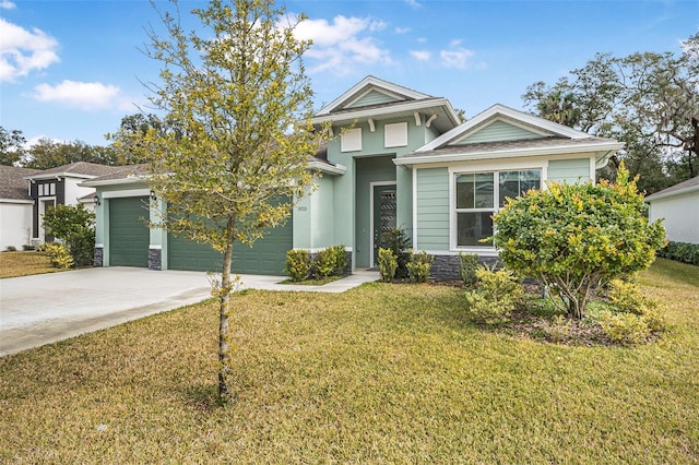 view of front of property with a garage and a front yard