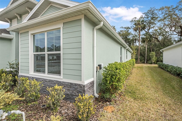 view of home's exterior featuring a lawn