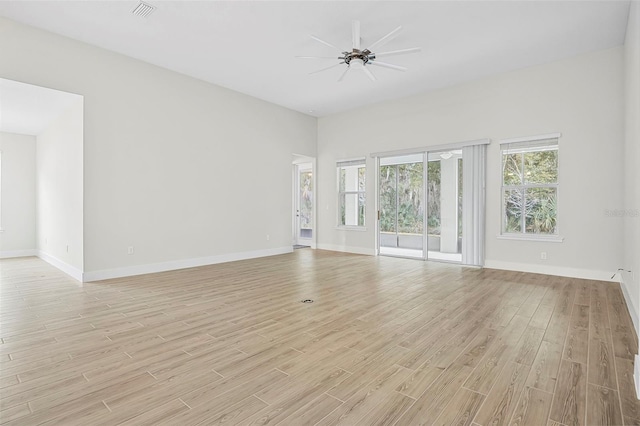 unfurnished living room with ceiling fan and light hardwood / wood-style flooring