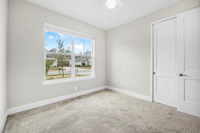 unfurnished bedroom featuring carpet and ceiling fan