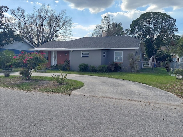 single story home featuring a front yard