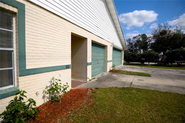 view of side of property with a garage