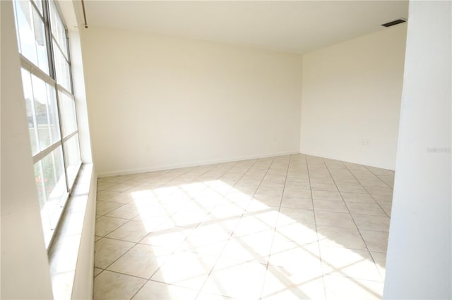 empty room with light tile patterned flooring