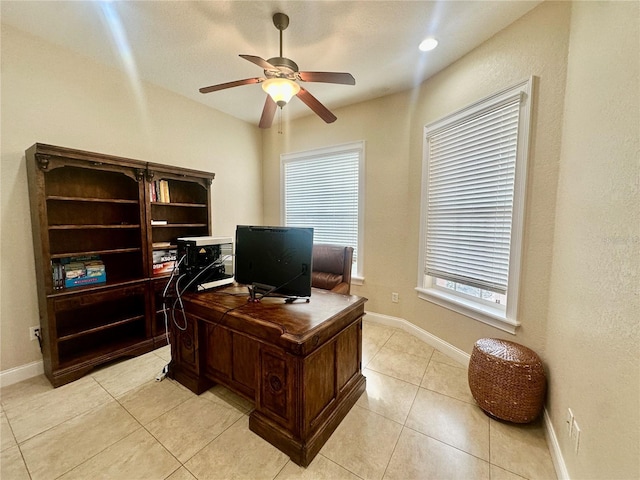 office with ceiling fan and light tile patterned flooring