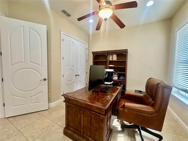 home office featuring plenty of natural light, light tile patterned floors, and ceiling fan