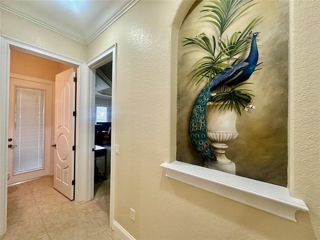 hallway featuring light tile patterned floors and ornamental molding