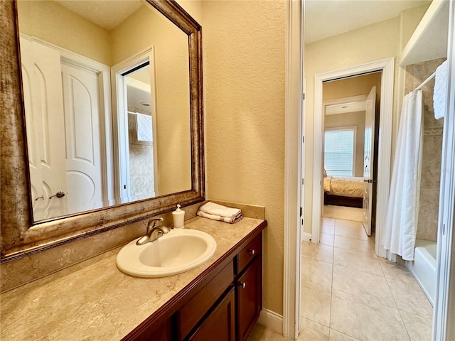 bathroom with vanity, tile patterned flooring, and shower / bath combo