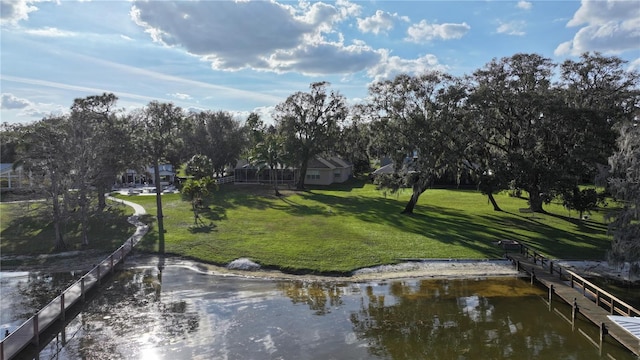 exterior space featuring a yard and a water view