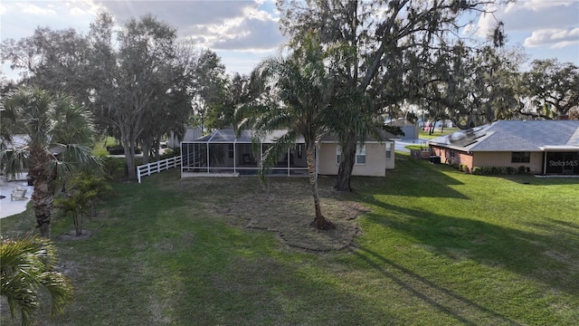 view of yard with a lanai