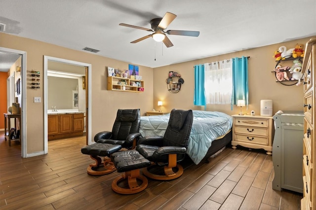 bedroom featuring ceiling fan, connected bathroom, and sink