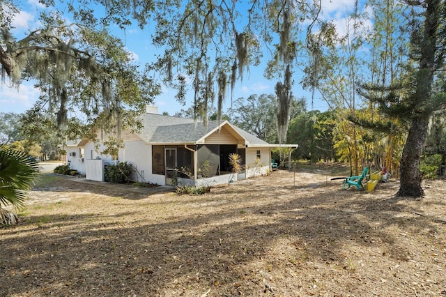 view of front of home with a sunroom