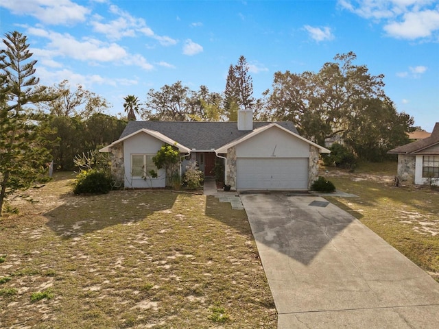 ranch-style house featuring a garage and a front yard