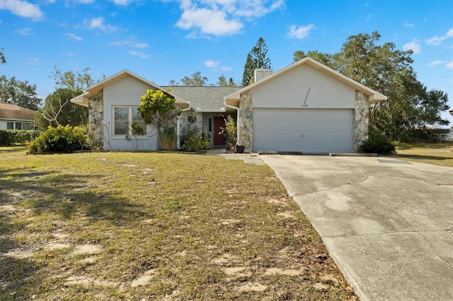 ranch-style home with a garage and a front lawn