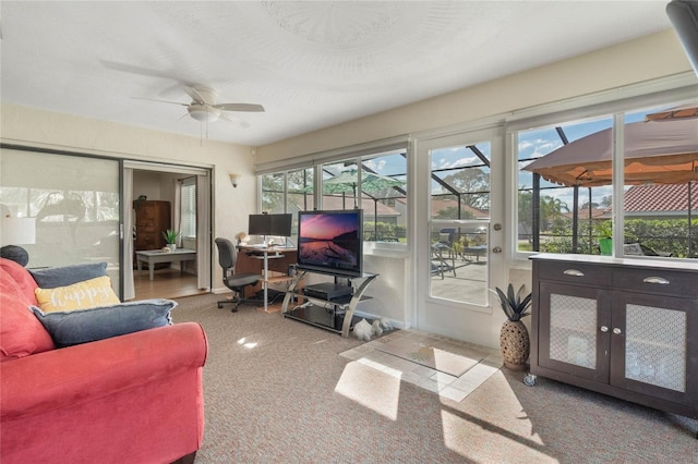 sunroom / solarium featuring ceiling fan and a wealth of natural light