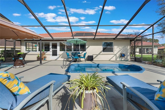 view of pool with a lanai and a patio area