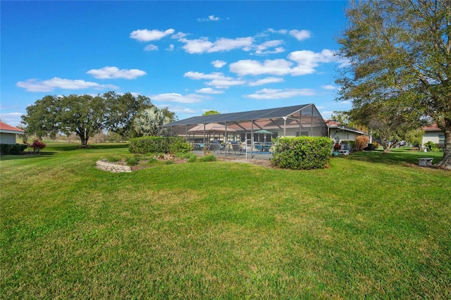 view of yard with a lanai