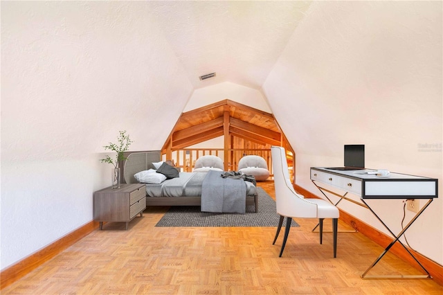 bedroom with baseboards, visible vents, a textured ceiling, and lofted ceiling