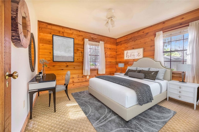 carpeted bedroom with multiple windows and baseboards