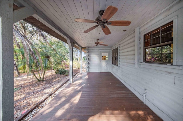 wooden terrace featuring a ceiling fan