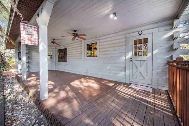 wooden deck featuring a ceiling fan