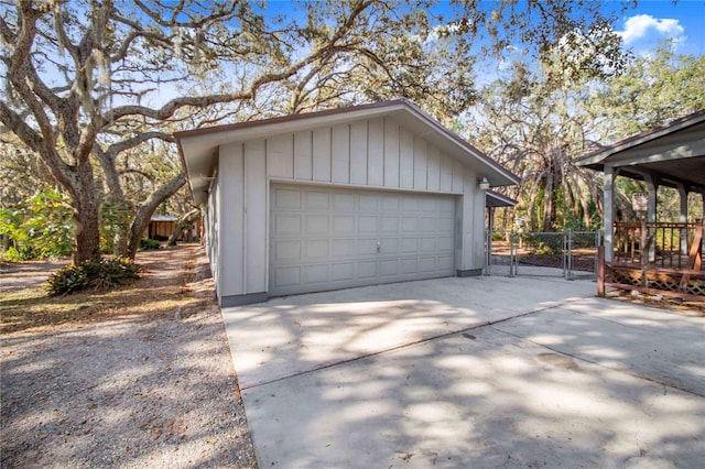 detached garage featuring fence