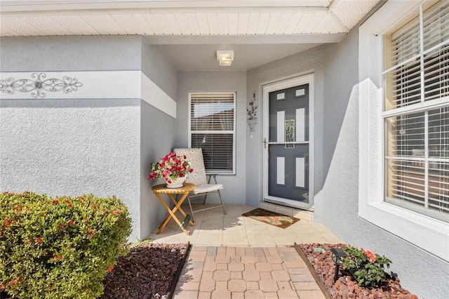 doorway to property featuring a patio