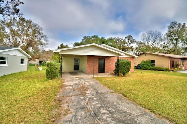 single story home featuring a carport and a front lawn