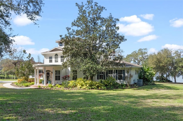 view of front of property with a front yard and covered porch