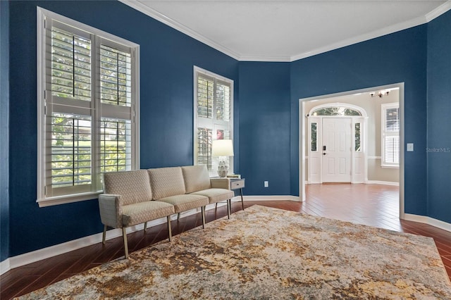 living room featuring crown molding and wood-type flooring