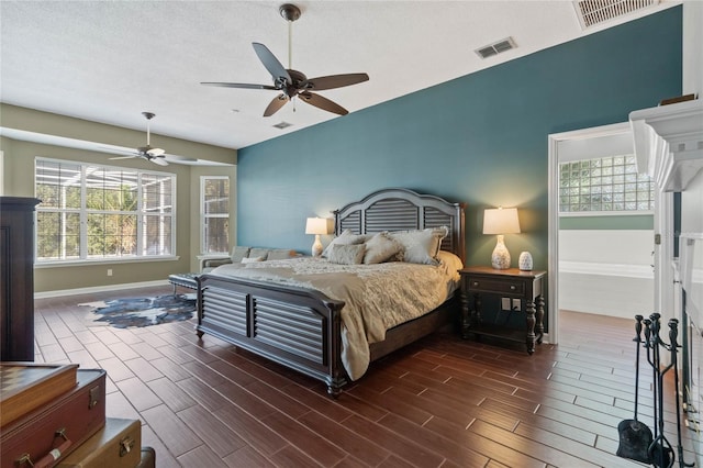 bedroom featuring a textured ceiling and ceiling fan