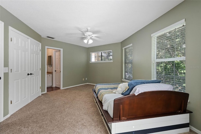 bedroom featuring a closet, ceiling fan, and carpet flooring