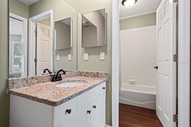 bathroom with vanity and shower / bathing tub combination