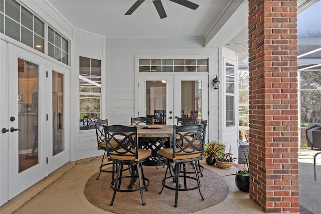 sunroom / solarium featuring ceiling fan and french doors