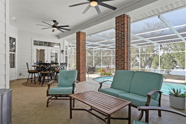 view of patio / terrace with a lanai, an outdoor hangout area, and french doors